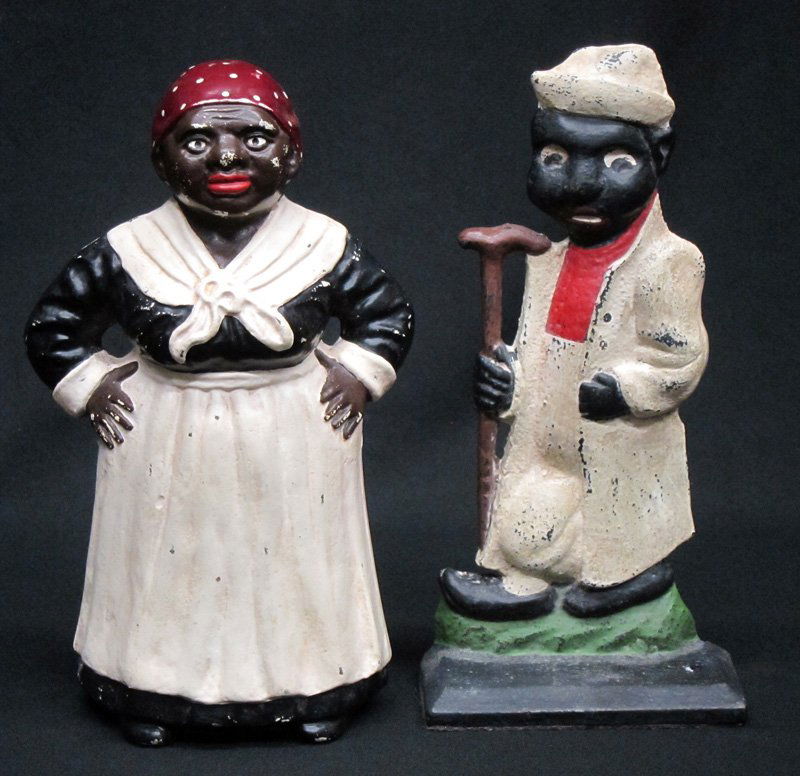BLACK AMERICANA DOORSTOPS (2): Large mammy and man with walking stick; painted cast iron; repainted; H-10 1 /2"