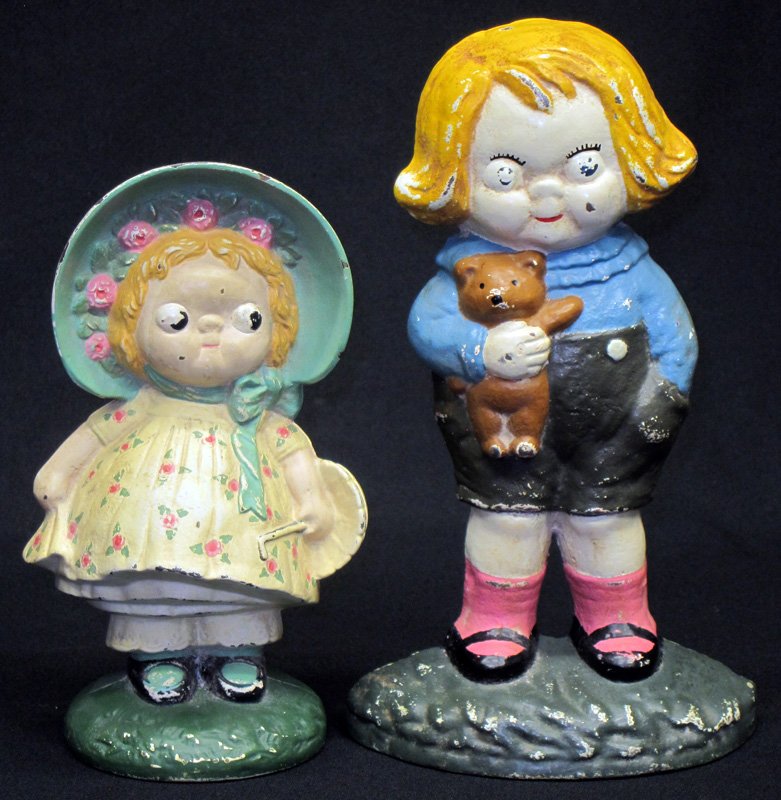 BOBBY BLAKE & DOLLY DIMPLE DOORSTOPS (2): Painted cast iron; repainted; H-8"-9 1/4"