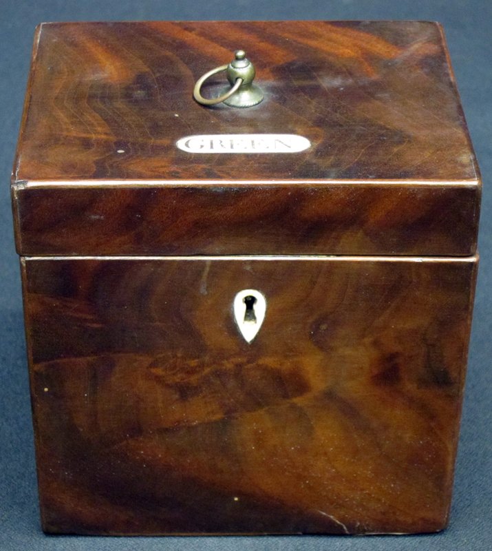 TEA CADDY: Mahogany with "green" ivory; inset label and escutcheon; interior appears to never having had a lid; H-4 1/2", G-VG