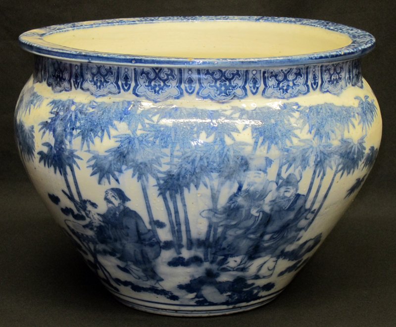 BLUE & WHITE PORCELAIN JARDINIERE: Blue and white transfer decorated with musicians and trees; (1) rim chip; (1) minor rim flake; H-11", Dia.-14", G