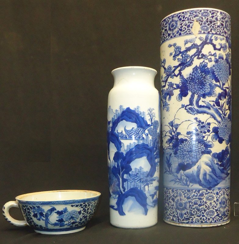 BLUE & WHITE PORCELAIN (3) PCS.: Painted porcelain; (1) umbrella stand has bottom broken out; (1) tall vase has circumference crack and chip; (1) handled piece has handle re-glued and missing top; tallest H-24", P-F