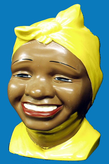 Black Americana CONTEMPORARY AUNT JEMIMA COOKIE JAR: Ceramic head with bandana; 3 repaired chips to outside of lid; 2 small chips to inside rim of lid; some crazing; no mark; H-11", F-G.