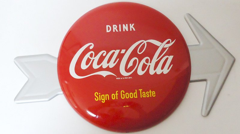 Coca Cola Button Arrow Sign.