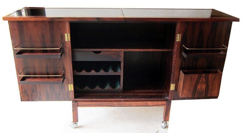 DANISH MODERN BAR CABINET: by Torbjorn Afdal for Bruksbo of Norway, book-matched Brazilian Rosewood portable bar; fitted interior, top flips and slides open to reveal black laminate surface; purchased from Scan Furniture in 196