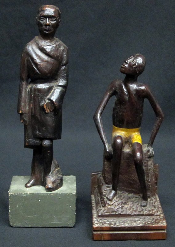 FOLK ART CARVED FIGURES (2): (1) Black man, seated, yellow polychromed shorts, signed D. S. Miller Kingston Jamaica; (1) standing figure in robe, part of hand missing; normal wear; H-8" - 11", G