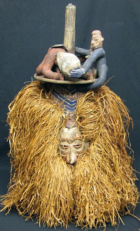 YAKA MASK: Carved wood; papier mache, raffia, polychrome; tagged "Yaka Puberty Mask" D. R. Congo; normal wear; H-32", G-VG