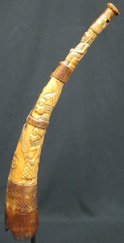 AFRICAN HORN CARVING: Antique carving with human relief carvings, cat, snake; several holes, wear; L-25", G