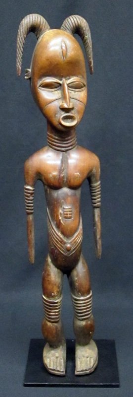 DAN COMPLEX FIGURE: Carved wood; Ivory Coast or Liberia; metal base; some small chips and normal wear; H-22", G