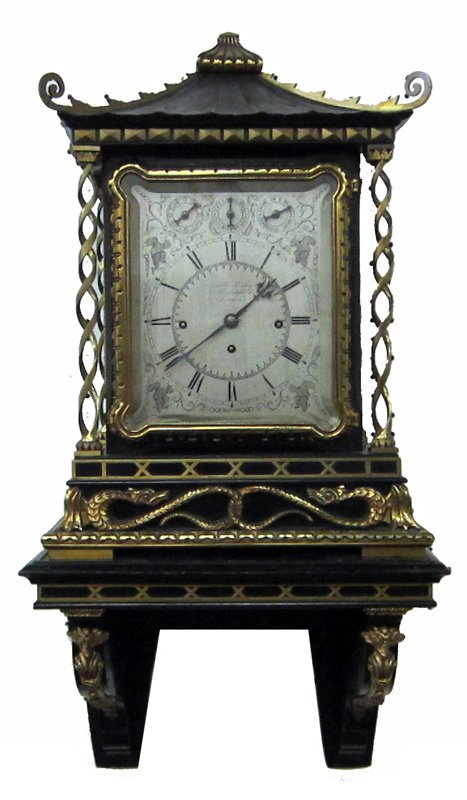 A & H ROWLEY BRACKET CLOCK: 40 Theobalds Road, London; Chinese motif, black lacquered pagoda case with brass trim and ormolu; silvered face; chime on 8 bells; Cambridge chimes; together with matching bracket; runs; clock H-24", 