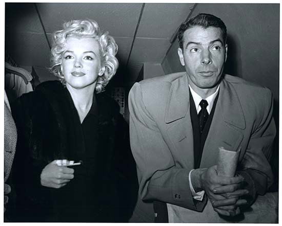 54 MARILYN MONROE & JOE DIMAGGIO BY KASHIO AOKI: Rare limited edition (No. 75/75) 8"x10" black & white photo of Marylyn & Joe taken on their plane during their honeymoon by Kashio Aoki, who was a Japanese Pan American Airline Precious Cargo Steward