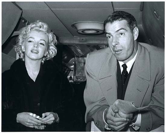 54 MARILYN MONROE & JOE DIMAGGIO BY KASHIO AOKI: Rare limited edition (No. 75/75) 8"x10" black & white photo of Marylyn & Joe taken on their plane during their honeymoon by Kashio Aoki, who was a Japanese Pan American Airline Precious Cargo Steward