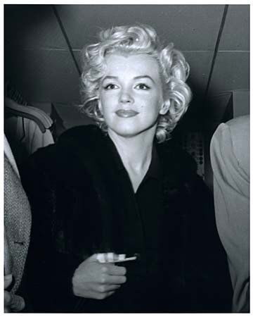 1954 MARILYN MONROE BY KASHIO AOKI: Rare limited edition (No. 75/75) 8"x10" black & white photo of Marylyn taken on her plane during her honeymoon with Joe DiMaggio by Kashio Aoki, who was a Japanese Pan American Airline Precious Cargo
