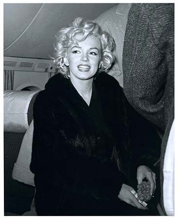 1954 MARILYN MONROE BY KASHIO AOKI: Rare limited edition (No. 75/75) 8"x10" black & white photo of Marylyn taken on her plane during her honeymoon with Joe DiMaggio by Kashio Aoki, who was a Japanese Pan American Airline Precious Cargo