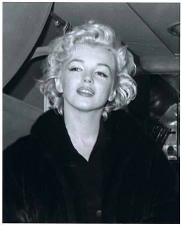 1954 MARILYN MONROE BY KASHIO AOKI: Rare limited edition (No. 75/75) 8x10" black & white photo of Marylyn taken on her plane during her honeymoon with Joe DiMaggio by Kashio Aoki, who was a Japanese Pan American Airline Precious Cargo S