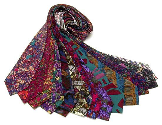 1990s BUZZ ALDRIN SPACE RELATED NECKTIES: Attractive lot of 13 different 100% silk neckties, Mainly Jerry Garcia (of Grateful Dead fame) designs based upon thin sections of Moon rocks brought back from Apollo missions. Almost new, unworn, man
