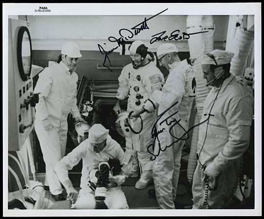 1969 CREW AUTOGRAPHED PRESS PHOTO: Original NASA 8"x10" black and white press photo on Kodak paper that shows Apollo 9 astronauts in white room during test. Autographed in black marker by Astronauts Jim McDivitt, David Scott and Rusty