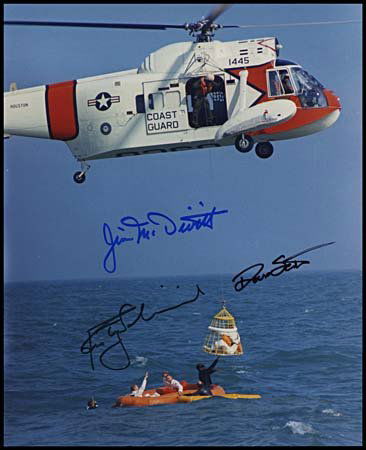 1969 CREW SIGNED PHOTO: An 8"x10" color photo on Fuji paper that shows Apollo 9 astronauts. Photo has been boldly signed in blue Sharpie by Astronauts Jim McDivitt, David Scott and Rusty Schweickart. Excellent condition.