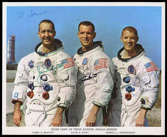 1969 COMPLETE CREW SIGNED CREW LITHO APOLLO 9: Original NASA issued color litho (8x10") showing the Apollo 9 flight crew. Litho signed in green sharpie by Jim McDivitt, black sharpie by David Scott and blue ball point pen by Russell Schweickart. S