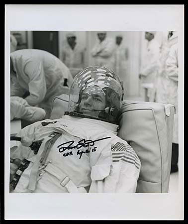 1971 DAVID SCOTT AUTOGRAPHED PHOTO: Vintage NASA 8"x10" black & white press photo showing Astronaut David Scott being suited-up. Scott autographed the photo in black sharpie & added 'CDR Apollo 15'. Very attractive.