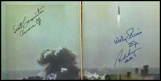 1962 'WE SEVEN' SIGNED BY CARPENTER, COOPER & SCHI: Three Mercury Astronauts have signed this hardbound copy (Book Club edition with dust jacket) of the book written by the Mercury 7. Each has added his Mercury flight name by his signature. Some wear t