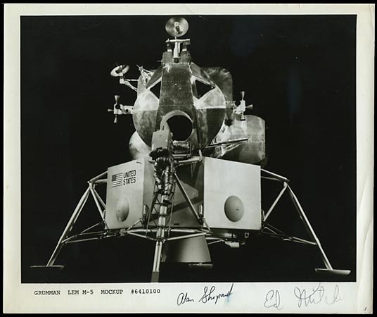 1971 SHEPARD & MITCHELL SIGNED PHOTO: Attractive 8"x10" original Grumman black & white glossy photo of LEM M-5 Mockup signed by Astronauts Alan Shepard and Ed Mitchell on the bottom right corner. Slight smudge on Shepard signature, minor 