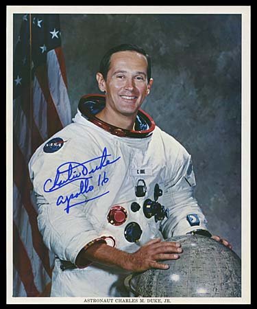 1972 AUTOGRAPHED CHARLES DUKE LITHOS: Three color lithos (8"x10") signed by Apollo 16 Astronaut Charles Duke. First is white spacesuit litho, second is crew in white spacesuits and third is Duke working next to lunar crater. All signed in