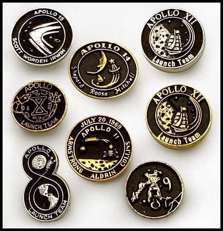 1968-71 APOLLO LAUNCH TEAM LAPEL PINS & MORE: Group of eight different lapel pins, black anodized on either gold or silver colored metal. Includes Apollo 8 Launch Team on silver, Apollo 9 on silver, Apollo 10 launch team on gold, Apollo 11 on gol