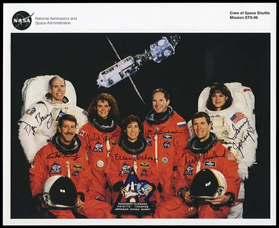 1999 STS-096 CREW AUTOGRAPHED LITHO: Rominger, Husband, Ochoa, Jernigan, Barry Payette & Tokarev signatures in black sharpie on this official NASA 8"x10" color lithograph of the entire crew, either in their orange pressure suits or in th