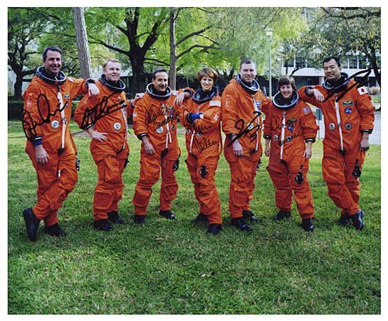 2005 STS-114 CREW SIGNED PHOTO: Very different color 8"x10" photo showing flight crew for STS-114. Signed in black sharpie by Astronauts Eileen Collins, James Kelly, Wendy Lawrence, Charles Camarda, Soichi Noguchi, Stephen Robinson