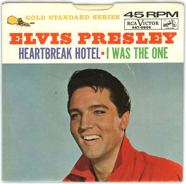 1964 'HEARTBREAK HOTEL/I WAS THE ONE' (RCA 447-060: Black label 45rpm, 'dog on top' and no horizontal silver line. With rare original 1964 Gold Standard Series picture sleeve of smiling Elvis head-shot with red shirt shows only light circle wear. Disc