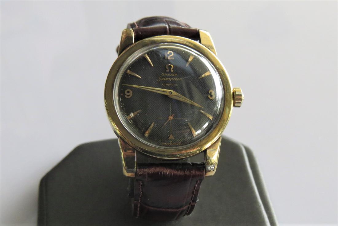 Vintage Omega Seamaster Watch: mens Vintage Omega Seamaster wrist watch. Automatic. Swiss made. Black face with genuine Italian calf skin band. 31mm case - 11mm Hadley-Roma 18R band with 7 adjustable wrist sizes. 28.0 DWT. 17 jewel