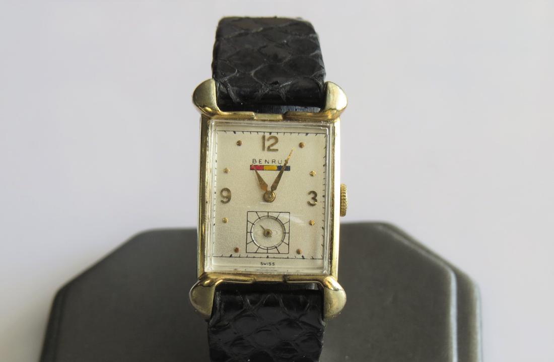 Vintage Benrus Gold Watch: Mens nice vintage Benrus wrist watch. 10K yellow gold filled case. Serial number 862510. Swiss made. Black leather band with 6 adjustable wrist sizes. Rectangle shaped case. 19x21mm case - 14mm band w