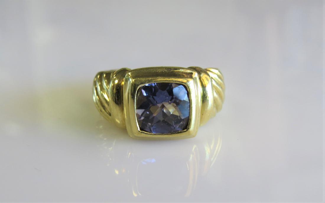 18K Yellow Gold David Yurman Tranzanite Ring: David Yurman discontinued tranzanite and 18k yellow gold ladies cable ring. 7.3DWT and is in excellent - polished and inspected condition. Size 7.