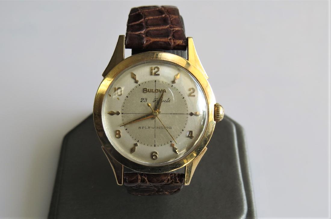Vintage Bulova 23 Jewels Watch: Vintage Bulova -23 jewels- wrist watch. Self winding. Movement has been replaced at some point with 17 jewel. Brown alligator Bulova band with 5 adjustable wrist sizes. 10K yellow gold plated case fro