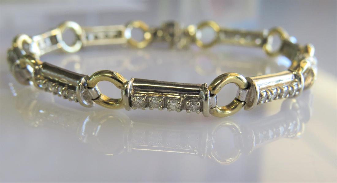 14K Two Toned LDS Fancy Diamond Tennis Bracelet: 14K Yellow gold with white gold ladies diamond tennis bracelet with fancy links. Set with approximately 1.20ct of SI-SI2 - full cut - round diamonds. Weighs 10.8dwt - 7.5- in length.