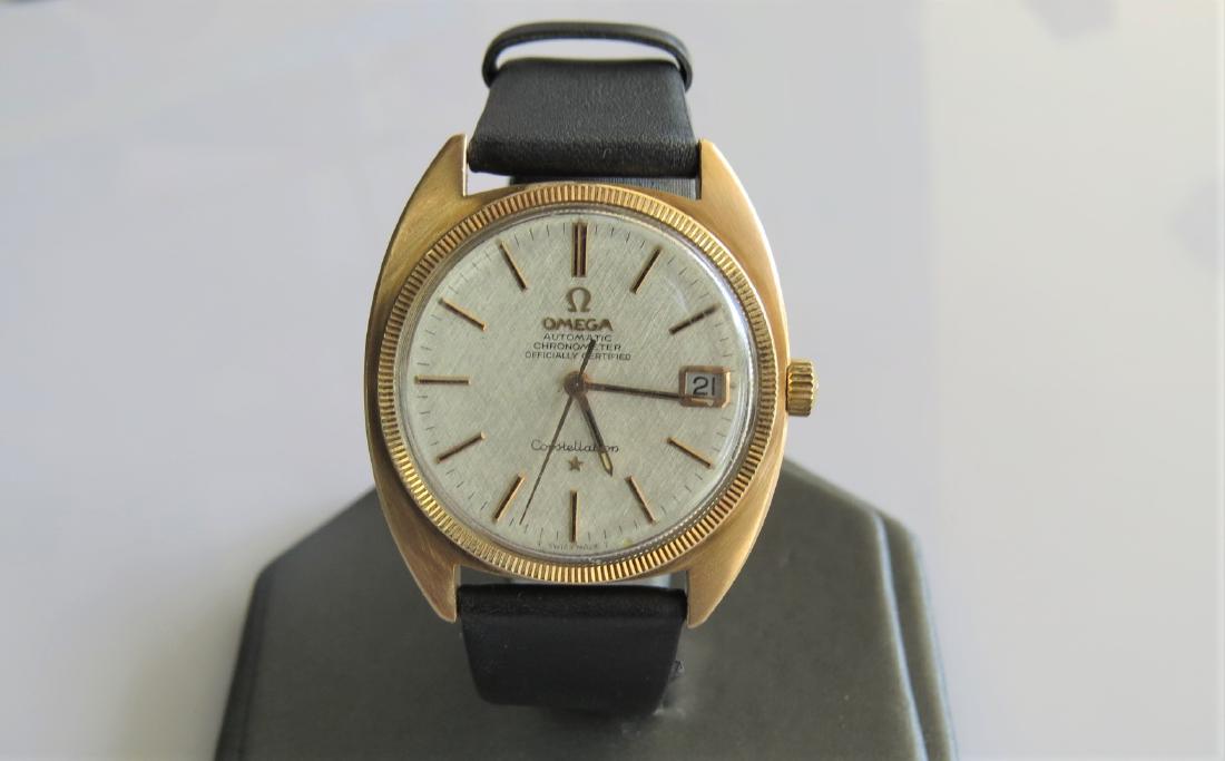 Omega Constellation Vintage Watch: Vintage Omega Constellation Mens wrist watch. Black genuine leather band with 7 adjustable wrist sizes. Automatic chronometer. Hadley-Roma band. 26mm face. 28.7 DWT. 24 jewels. Circa 1968. Serial numb