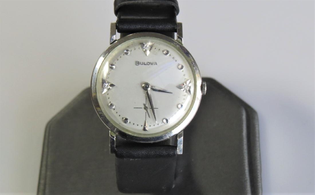 Vintage Bulova Watch: 10KT White Gold mens Bulova watch. G283190. Circa 1963. 3 round IJ diamond hour markers. Engraved -Charles - all my love - Shirley 8-19-63-. 23mm case. Black genuine leather band with 7 adjustable siz