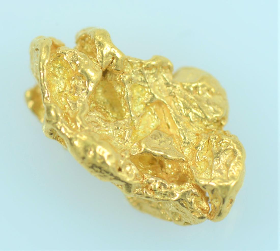 Gold Nugget: 20.5K to 22K purity gold nugget weighing 1.8 grams.