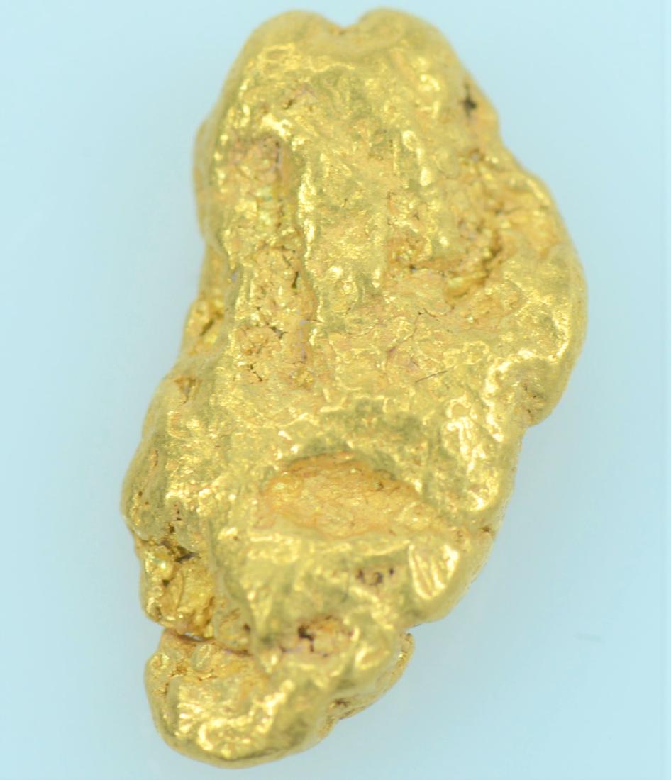 Gold Nugget: 20.5K to 22K purity gold nugget weighing 2.1 grams.