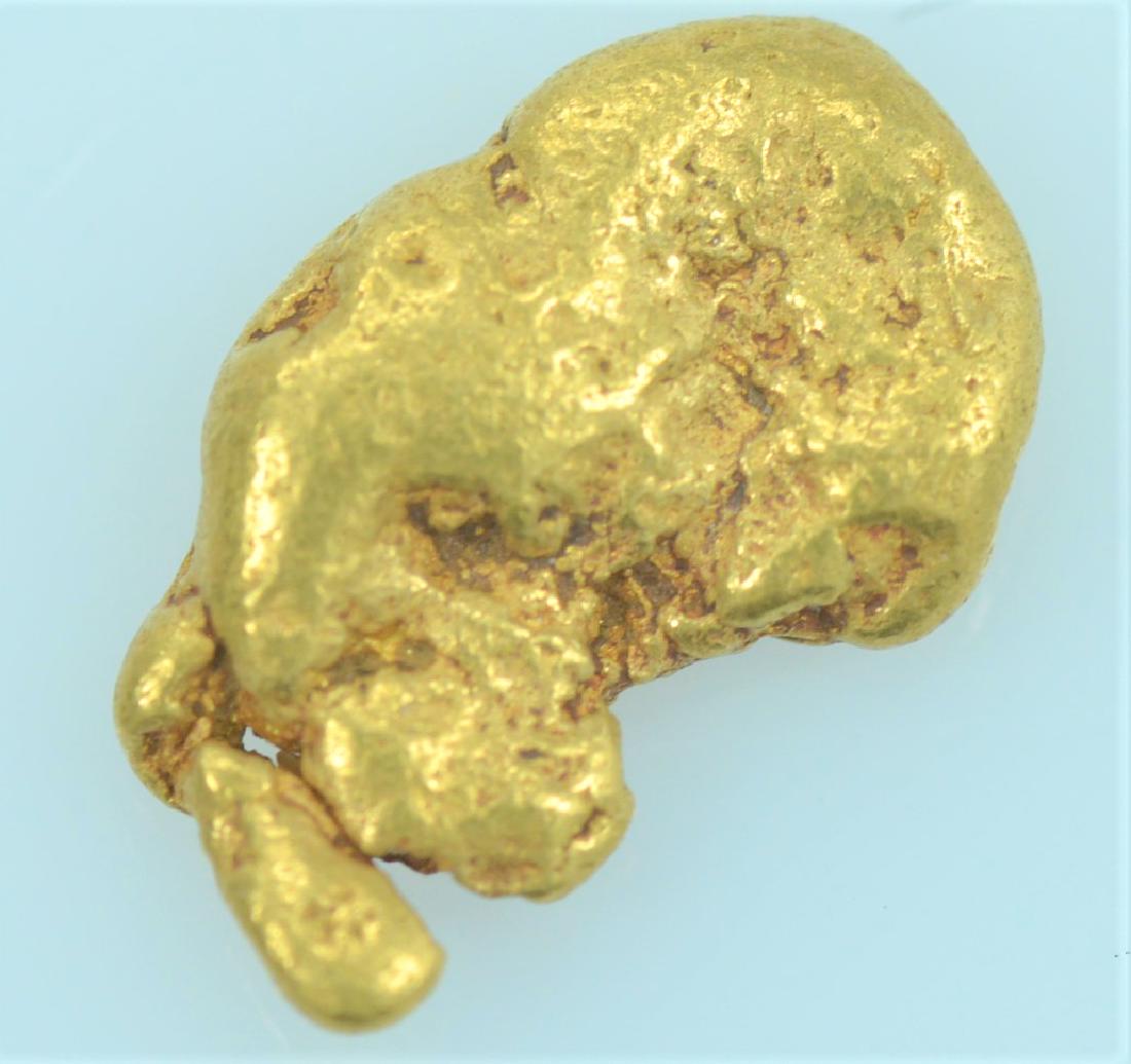 Gold Nugget: 20.5K - 22K purity gold nugget weighing 1.0 gram.