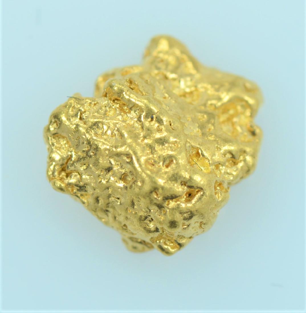 Gold Nugget: 20.5K - 22K purity gold nugget weighing 1.1 grams.