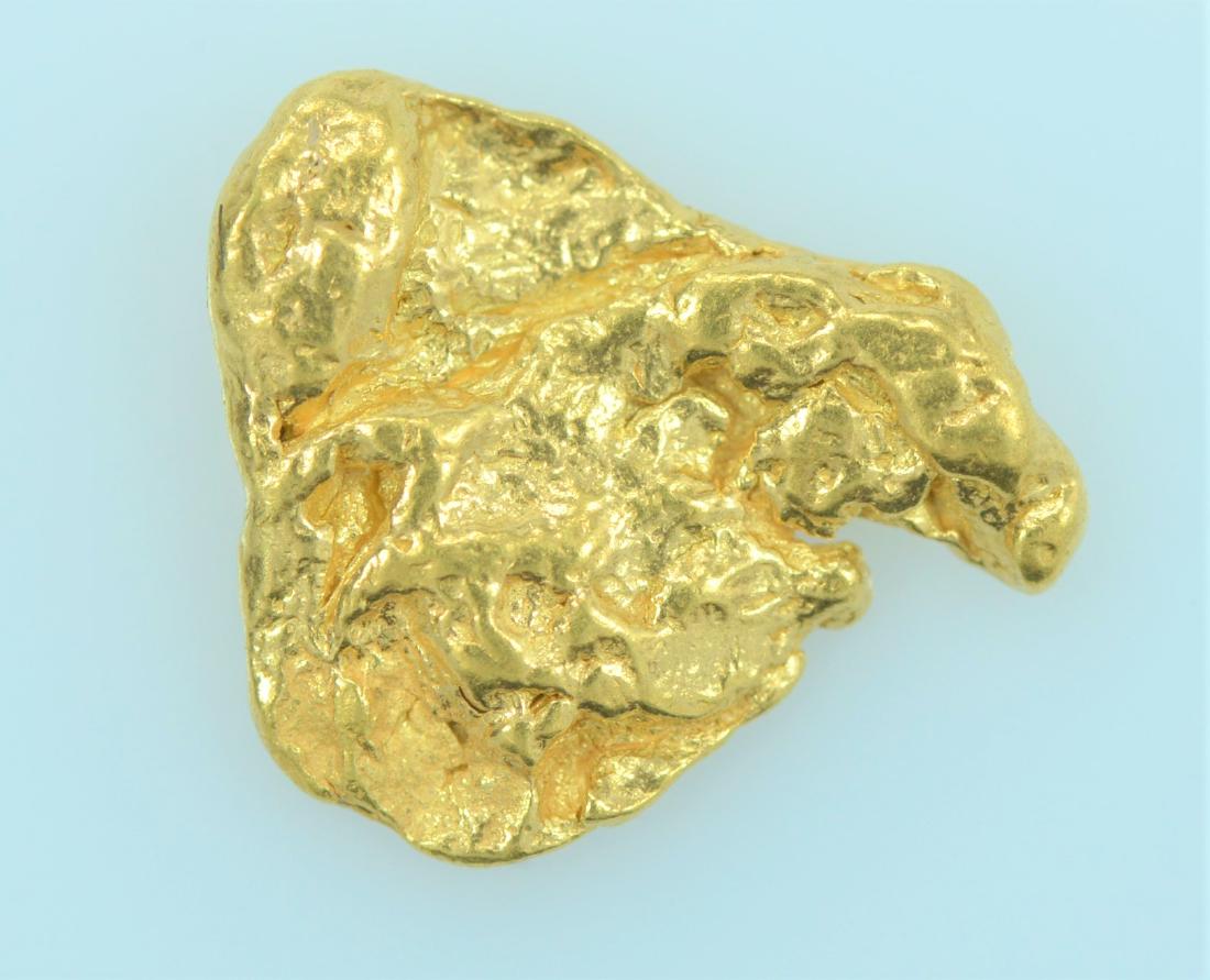 Gold Nugget: 20.5K - 22K purity gold nugget weighing 1.5 grams.