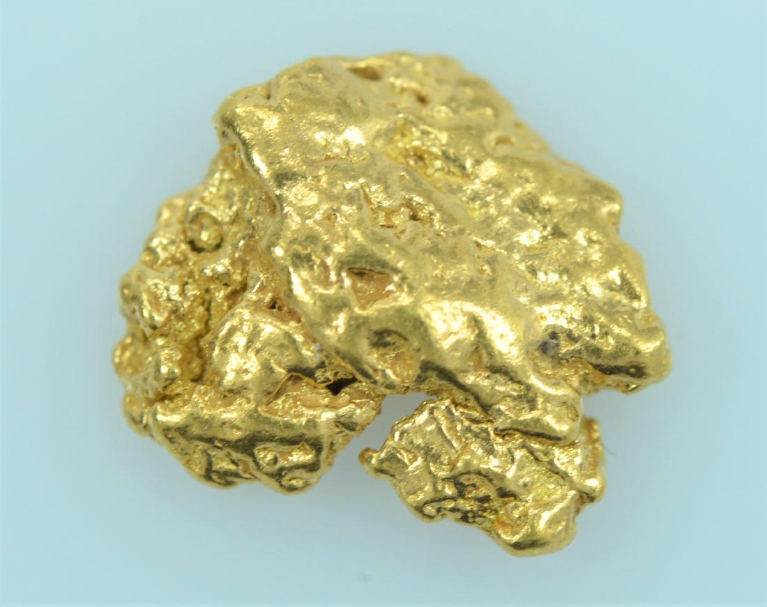 Gold Nugget: 20.5K - 22K purity gold nugget weighing 1.9 grams.