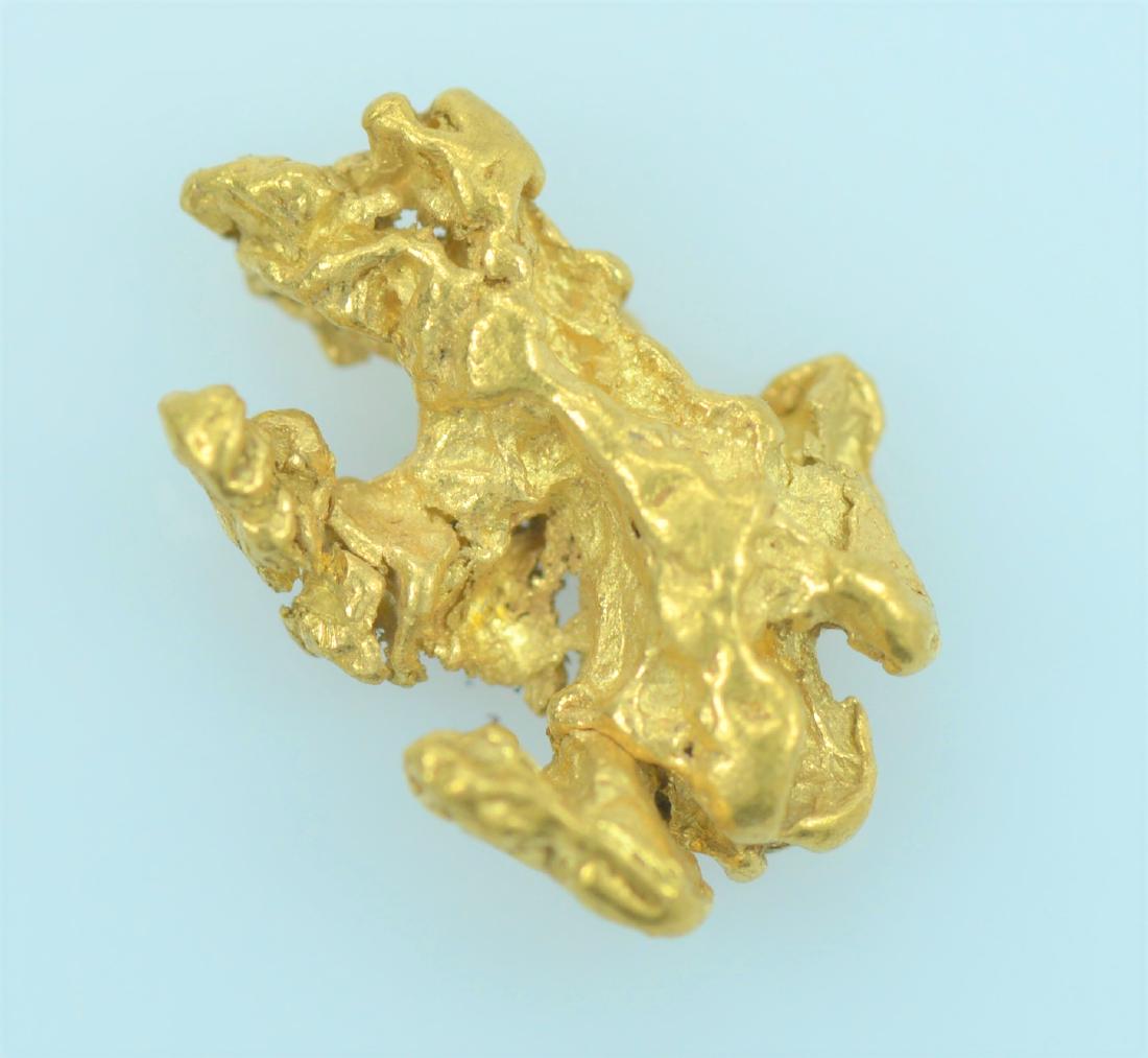 Gold Nugget: 20.5K - 22K purity gold nugget weighing 1.0 gram.