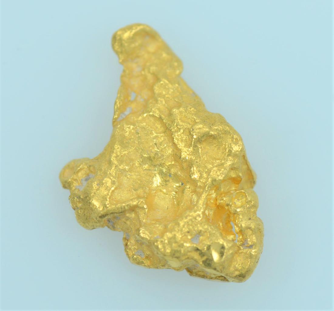 Gold Nugget: 20.5K - 22K purity gold nugget weighing 1.6 grams.