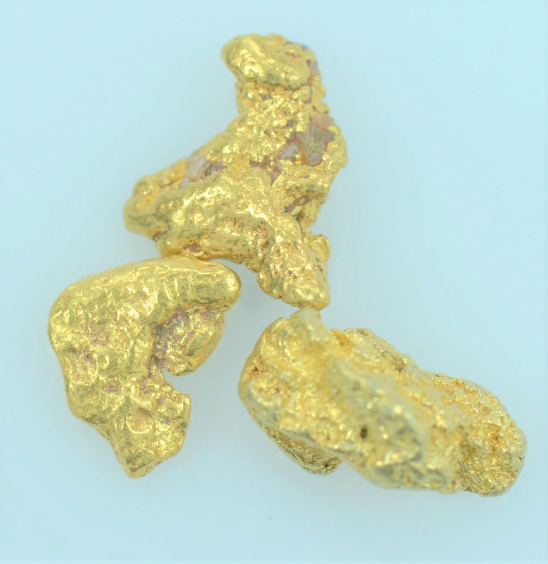Gold Nuggets: Three 20.5K - 22K purity gold nuggets weighing 1.1 grams total.