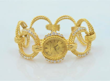 Gubelin Vintage Gold Watch: Gubelin vintage gold and diamond womens wind up watch. 18KT yellow gold - approximately 1.5 carats in combined diamonds. Diamond color -F/G - diamond clarity - VS. 59.8 grams.