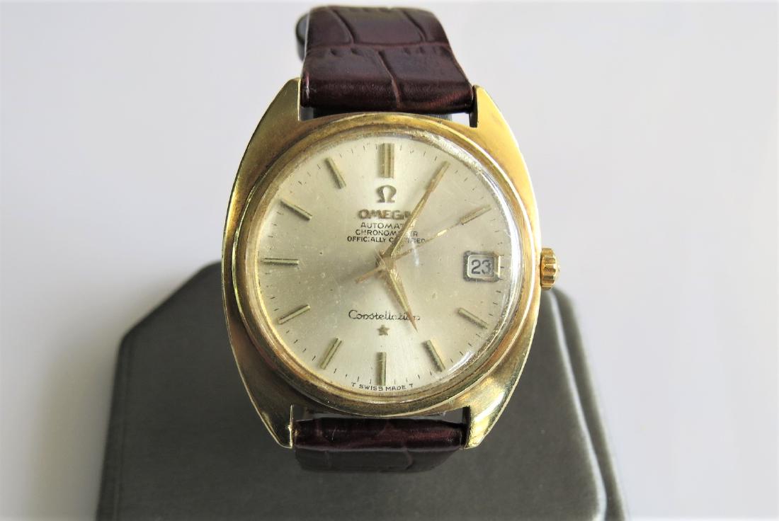 Vintage Omega Watch: Vintage Omega Constellation Wrist Watch men's. Genuine leather brown band with 7 adjustable sizes. Circa 1966. 26mm case. Casing has some scratches. 46.6 grams. 14K Gold plated. Working.