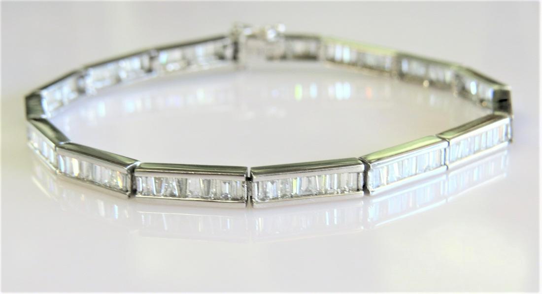 Baguette Diamond Tennis Bracelet -Stunning: 14K white gold baguette cut diamond tennis bracelet with approximately 3.00 Carats Total Diamond Weight of G-H VS Natural Diamonds 7.5" length, 4mm width. 10.6 grams.