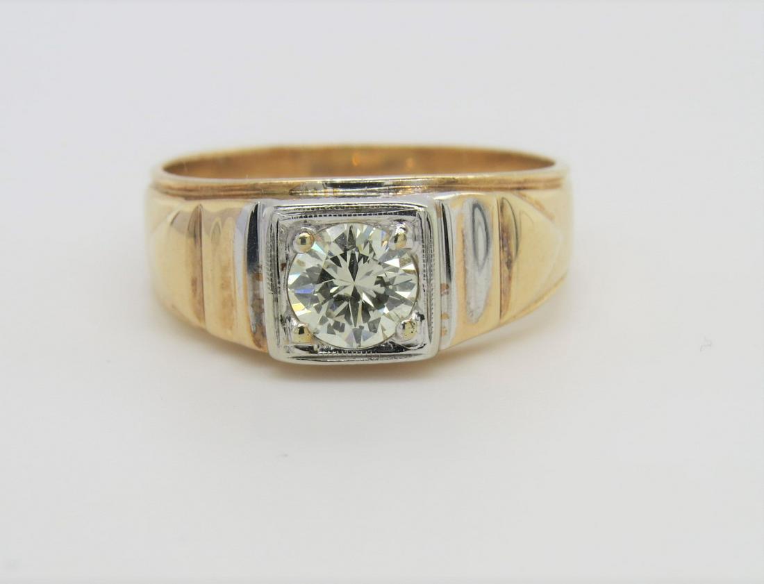 14K Two Tone Gold and Diamond Men's Ring: Stamped 14K yellow and white gold two toned men's diamond solitaire ring. Center round brilliant cut diamond is approximately 0.75 cts, SI2 clarity, J/K color. Tapered band from 8.5 mm - 4 mm. Ring si